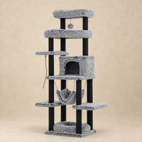 Grand arbre à chat Pebble gris de 185 cm avec niche, hamac et plateformes sur fond beige